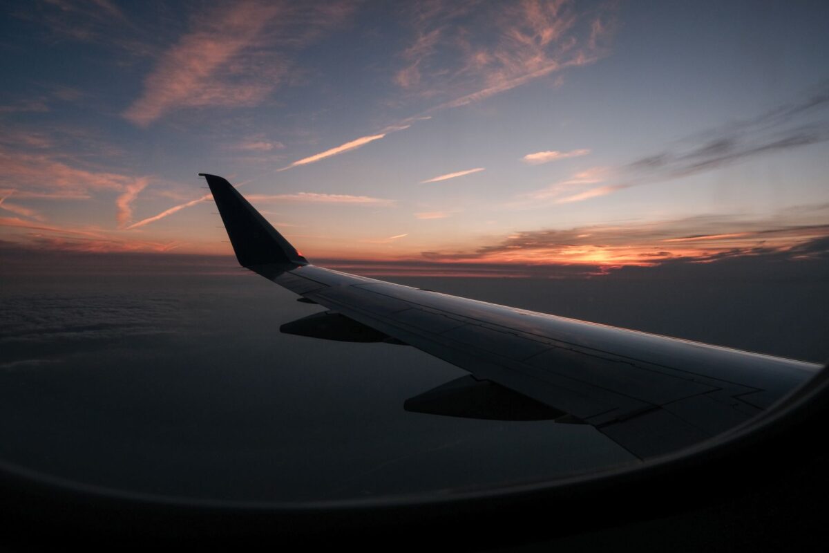 airplane wing sunset flight window